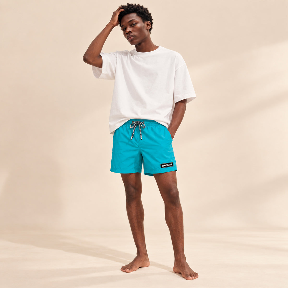 Maillot de bain turquoise pour homme. Patch beauséjour caoutchouc sur la cuisse. Vue 1.