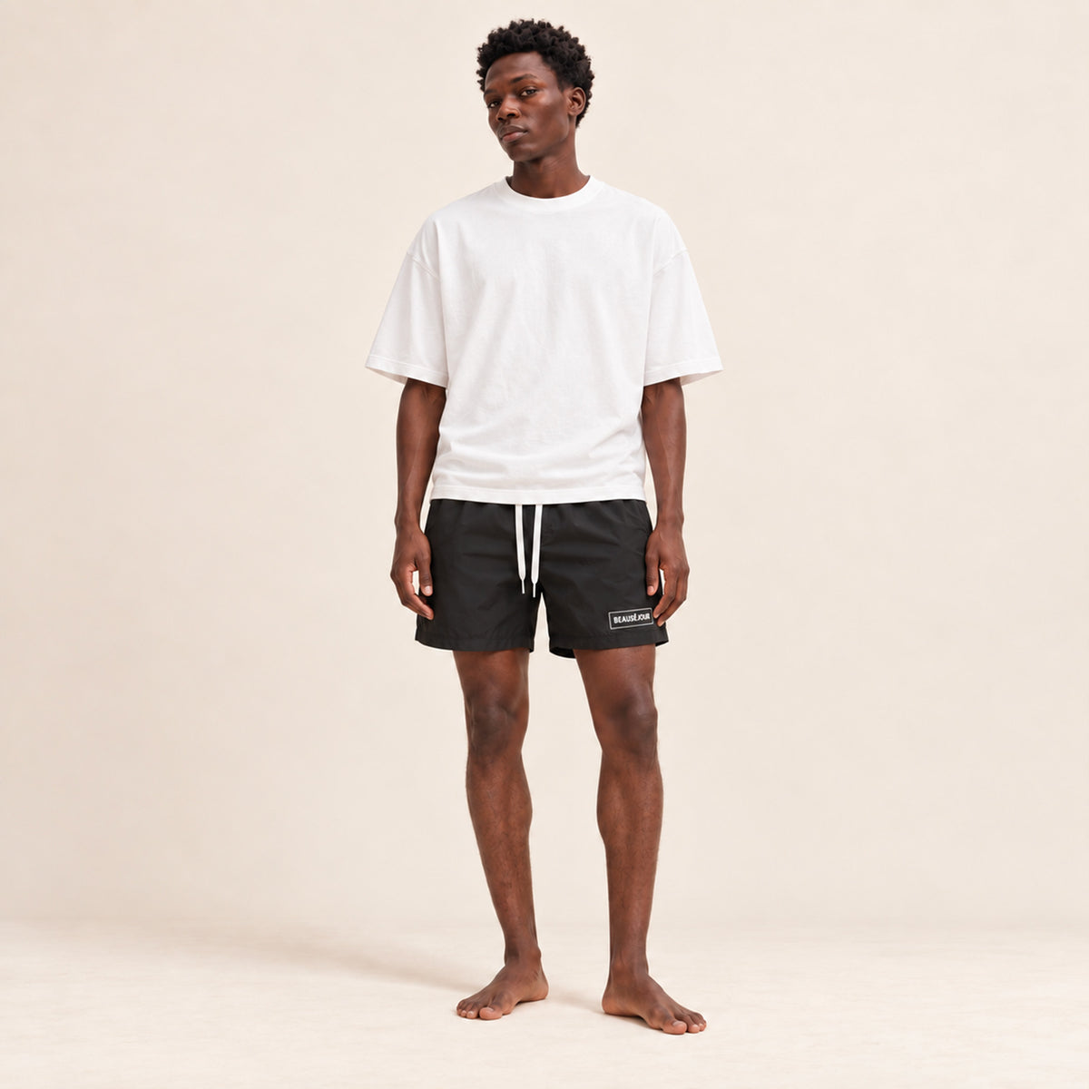 Maillot de bain noir pour homme. atch Beauséjour en caoutchouc signature sur la cuisse.