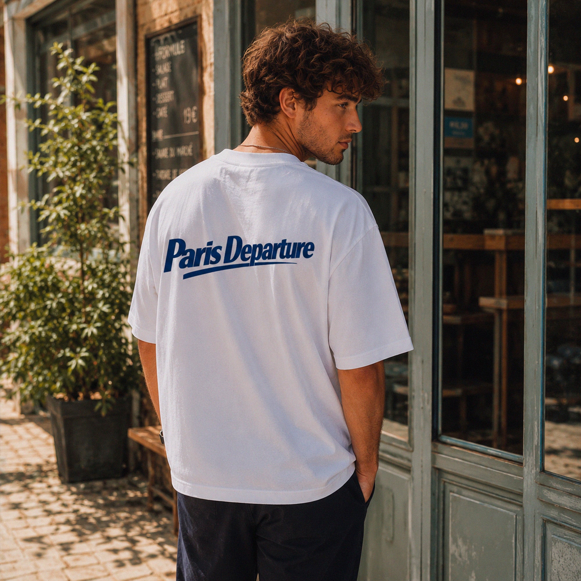 T-shirt boxy Paris Departure Beauséjour Orient Express, coloris blanc, jersey 200 g/m² 100% coton biologique, imprimé Paris Departure côté cœur et logo dos façon billet de train, vue de dos.
