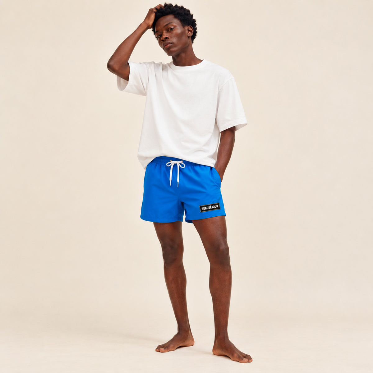 Maillot de bain bleu pour homme. Imrpimé patch caoutchouc sur l'avant. cordons.